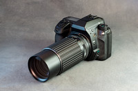 Digital SLR Camera Body and Lens on Gray