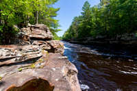 rocky banks and forests along kettle river at banning