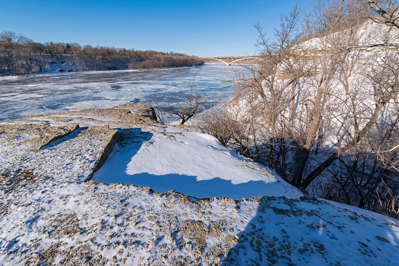 atop cliff overlooking frozen mississippi river